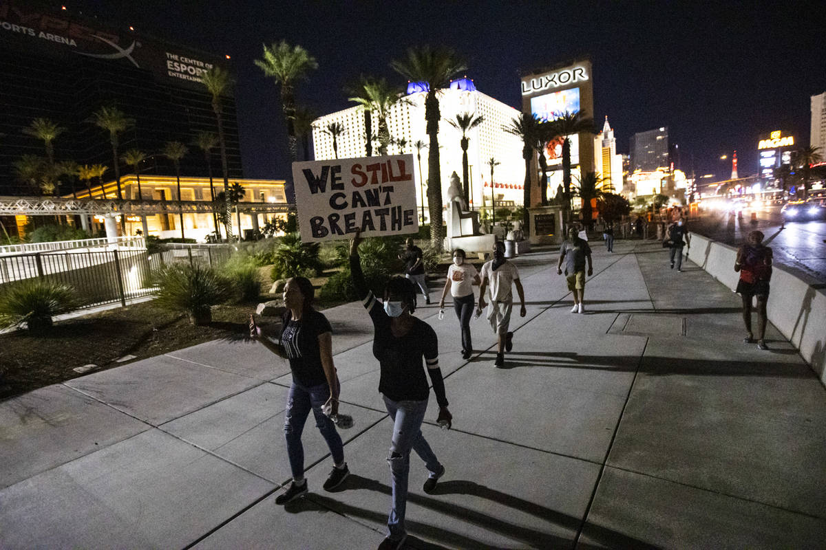 Demonstrators march to demand justice for George Floyd along the Las Vegas Strip on Thursday, M ...