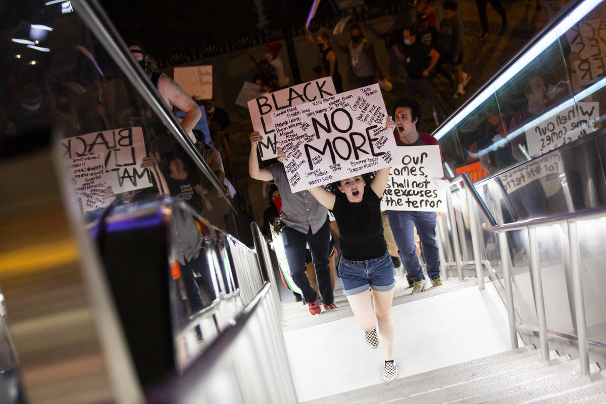 Demonstrators march to demand justice for George Floyd along the Las Vegas Strip on Thursday, M ...