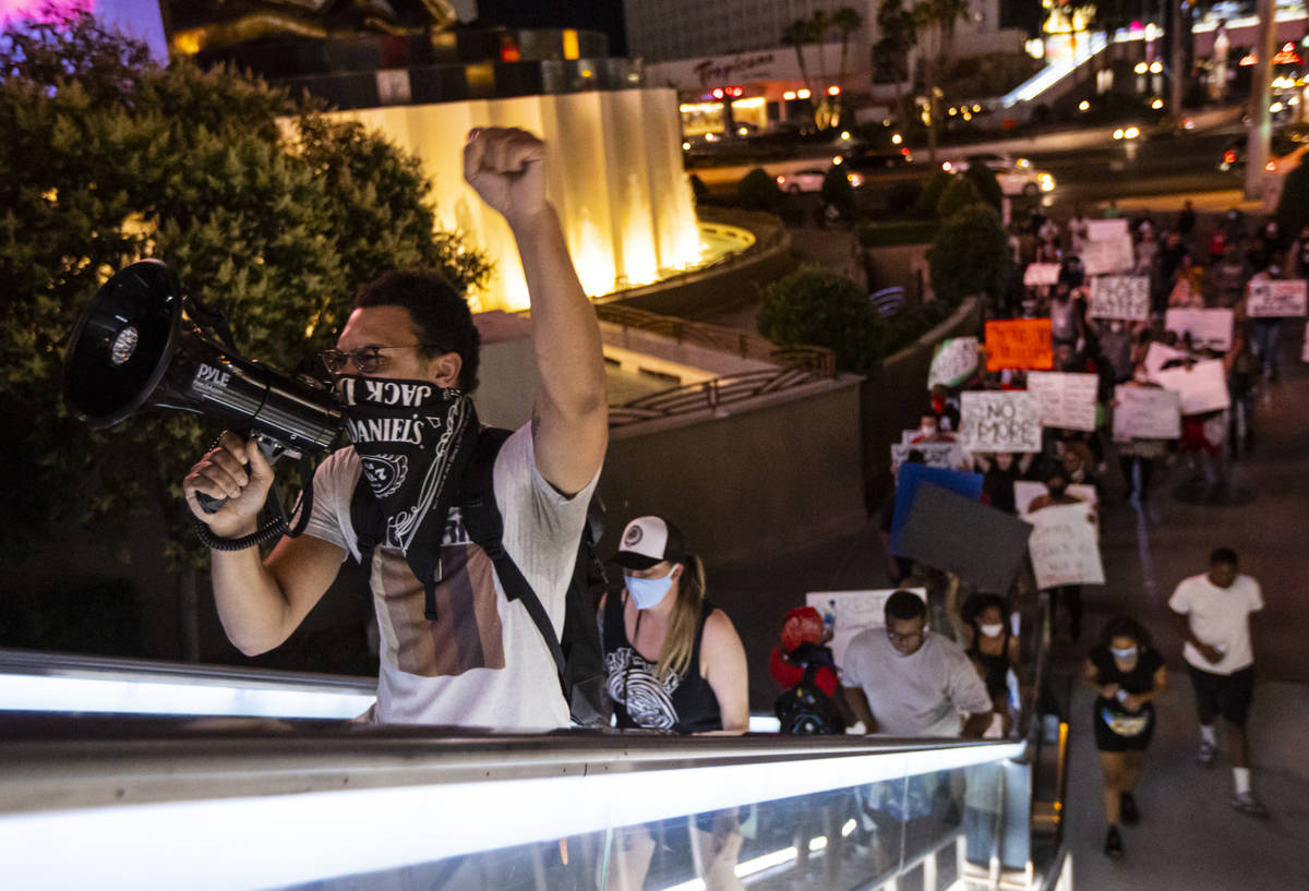 Demonstrators march to demand justice for George Floyd along the Las Vegas Strip on Thursday, M ...