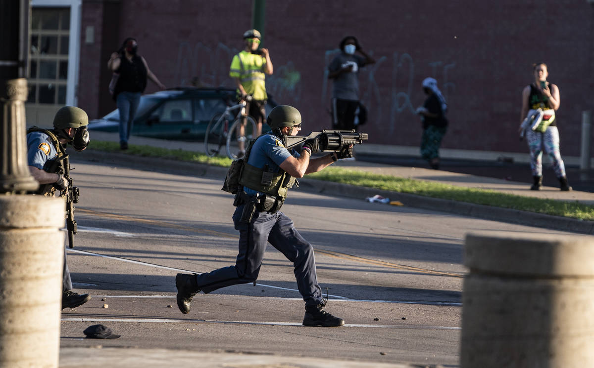 Police take control of the area near the Super Target against protesters Thursday, May 28, 2020 ...