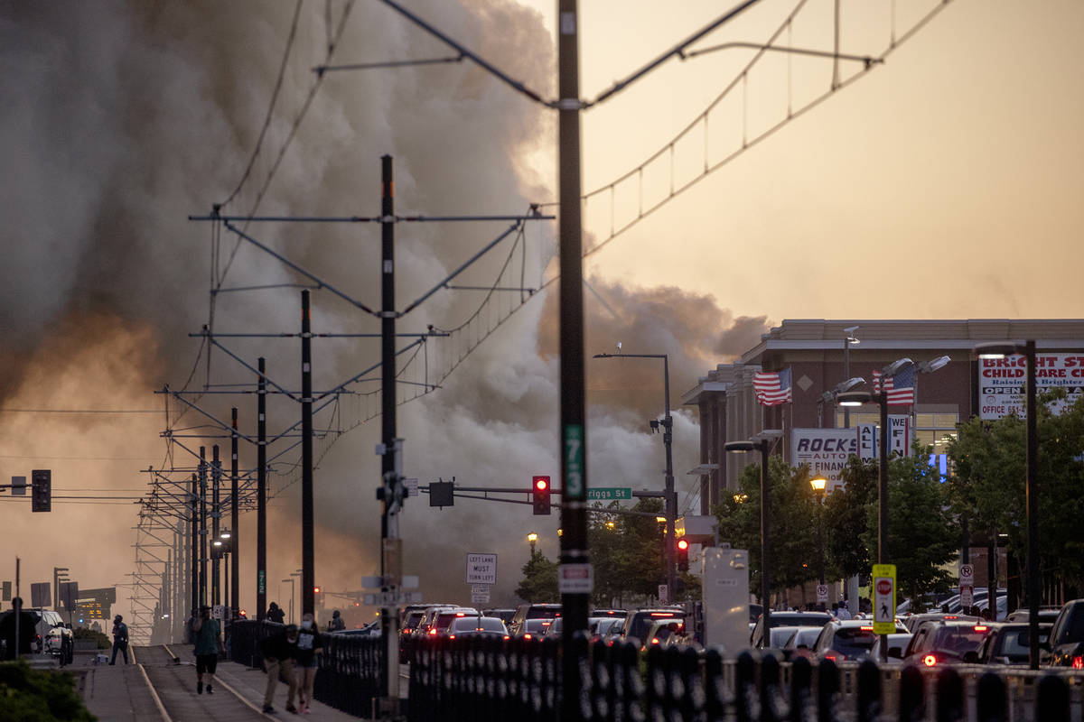 Smoke rises from fires as seen from University Avenue on Thursday, May 28, 2020, in St. Paul, M ...