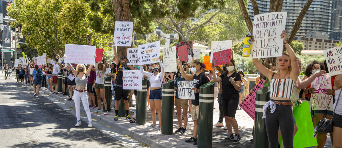 Protestors line the street near the Bellagio Fountains during a Black Lives Matter protest and ...