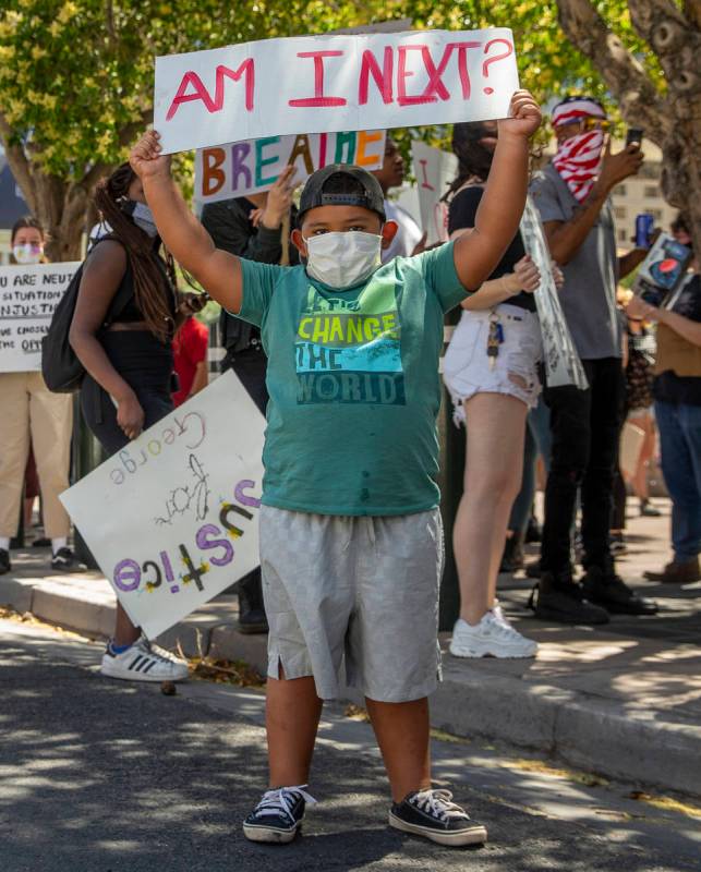Protestor Landon Smith, 5, holds his sign near the Bellagio Fountains during a Black Lives Matt ...