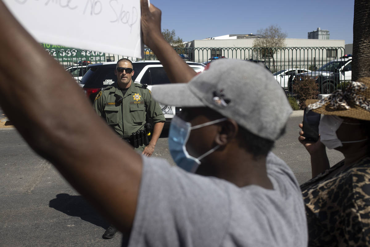 Las Vegas police respond to protesters who marched and chanted in response to the killing of Ge ...