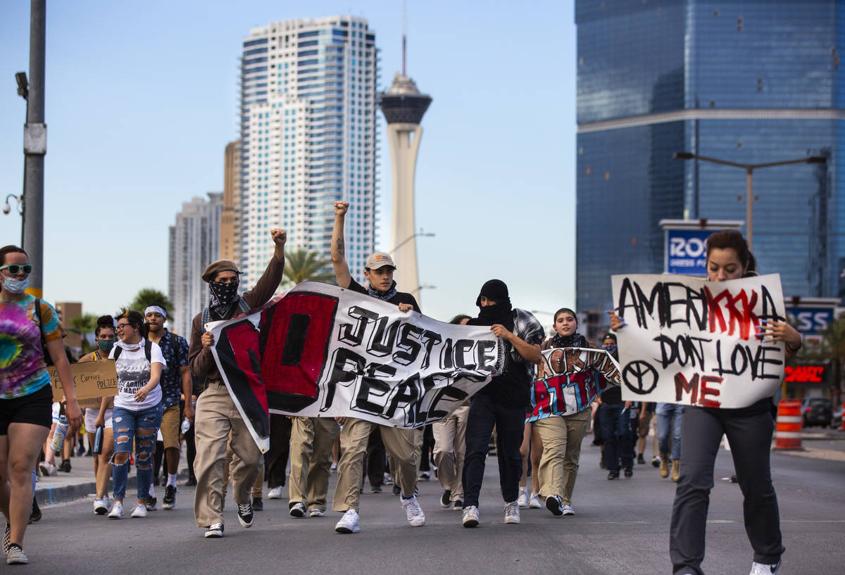 Demonstrators march to demand justice for George Floyd along the Las Vegas Strip in Las Vegas o ...