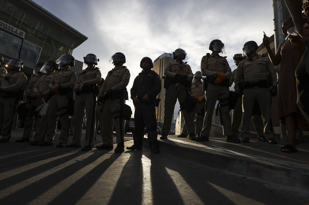 Police block the road leading to Trump Tower along the Las Vegas Strip in Las Vegas on Friday, ...