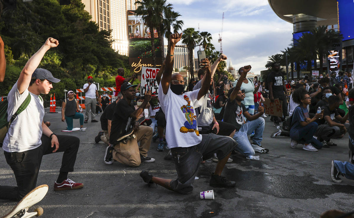 Demonstrators face off with police to demand justice for George Floyd along the Las Vegas Strip ...