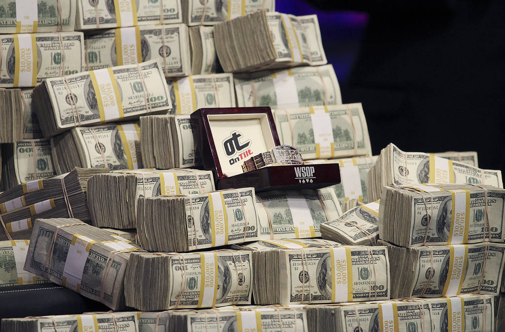 The 2011 WSOP Championship Bracelet is displayed along with bundles of cash during the World Se ...