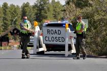 Park Rangers close the entrance to the Grand Canyon for the day Friday, May 15, 2020, in Grand ...