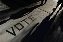 In this Nov. 6, 2018 file photo, voters head to the polls at the Enterprise Library in Las Vega ...