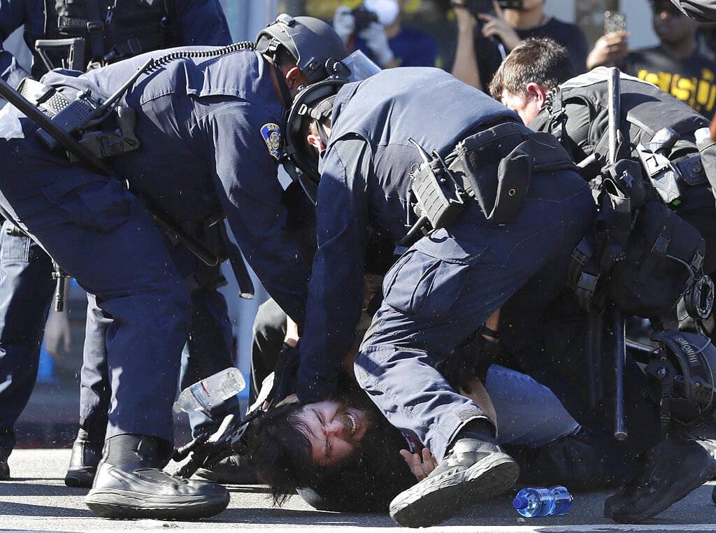 San Jose police subdue a man prior to arresting him during a protest over the Memorial Day deat ...