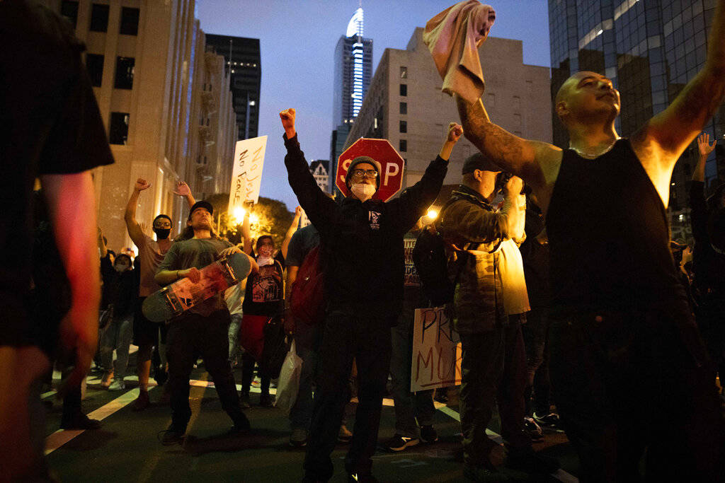 People demonstrate in Los Angeles, Friday, May 29, 2020, in protest over the death of George Fl ...