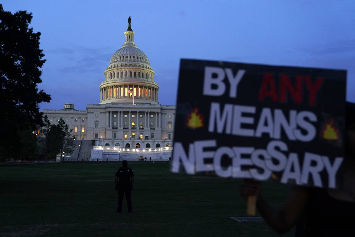 Demonstrators protest the death of George Floyd, a black man who died in police custody in Minn ...