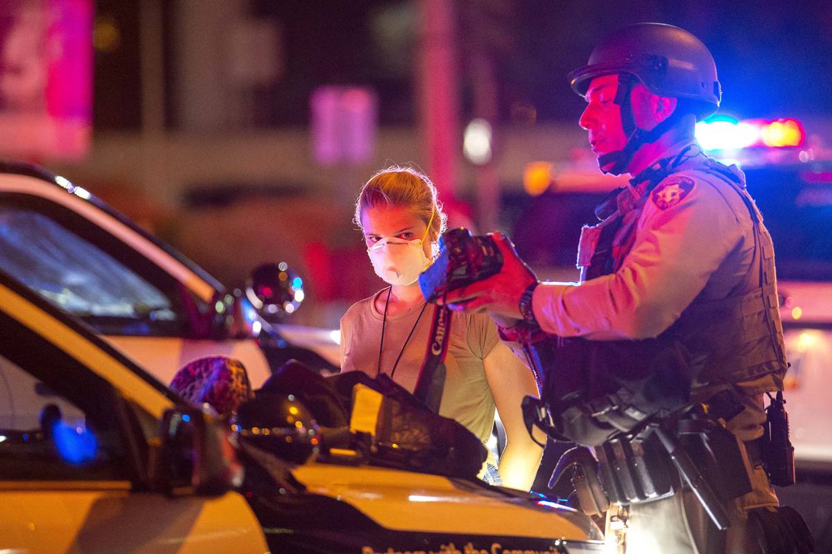 Las Vegas Review-Journal staff photographer Ellen Schmidt is arrested by Metropolitan Police of ...