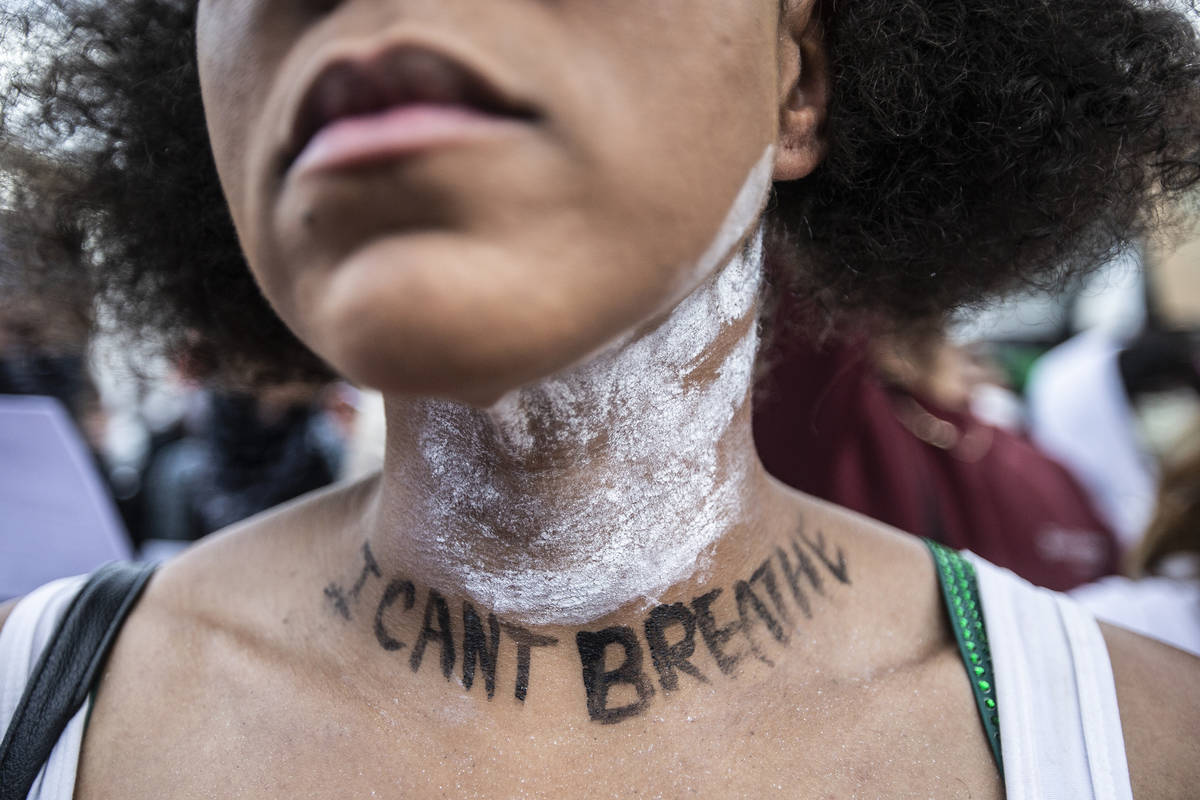 A large crowd protests in downtown Las Vegas during an event organized by Black Lives Matter on ...