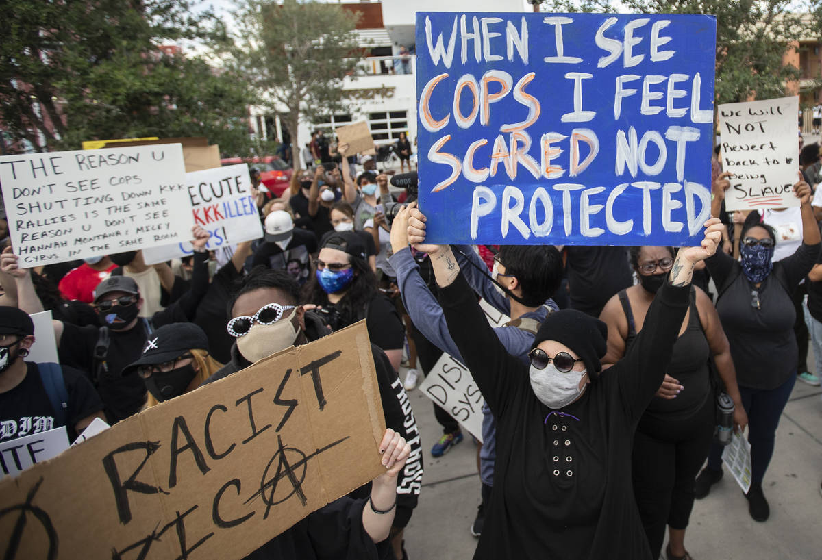 A large crowd protests in downtown Las Vegas during an event organized by Black Lives Matter on ...