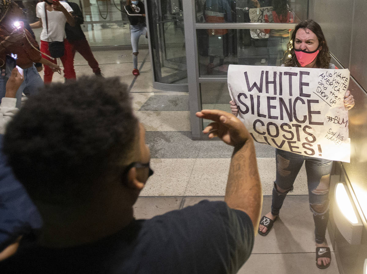 Protesters argue in downtown Las Vegas during an event organized by Black Lives Matter on Satur ...