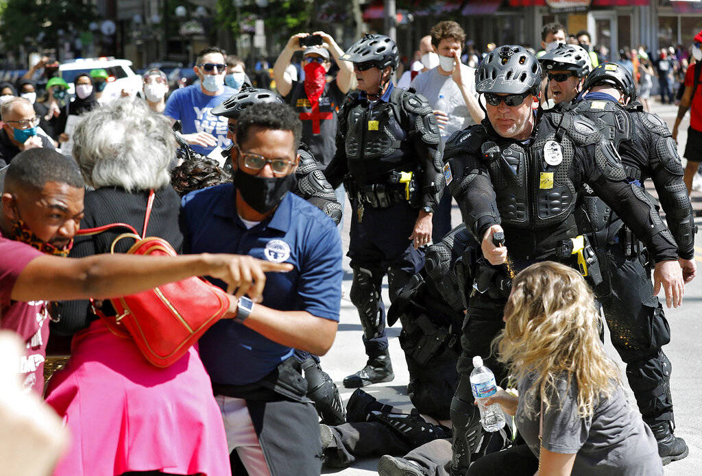 Congresswomen Joyce Beatty and Columbus City Council President Shannon Hardin try to intervene ...