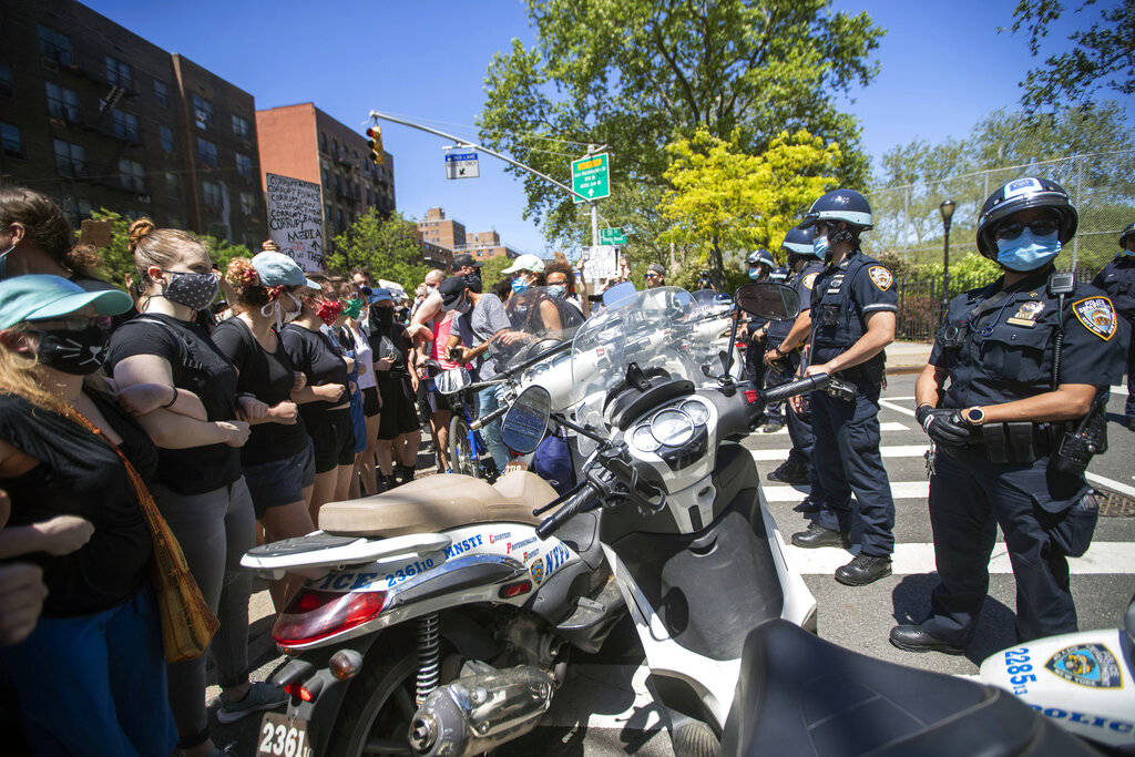 Protesters confront police blocking there access to the FDR Drive during a solidarity rally for ...