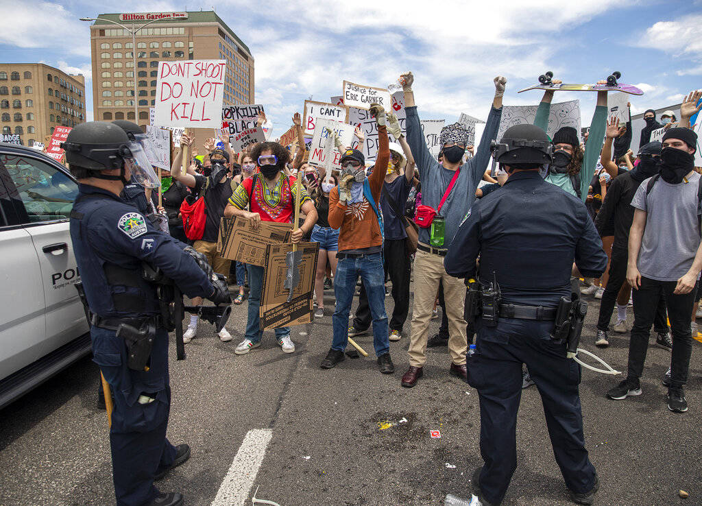 Protesters face off with police as they shut down southbound Interstate 35 freeway in Austin Te ...
