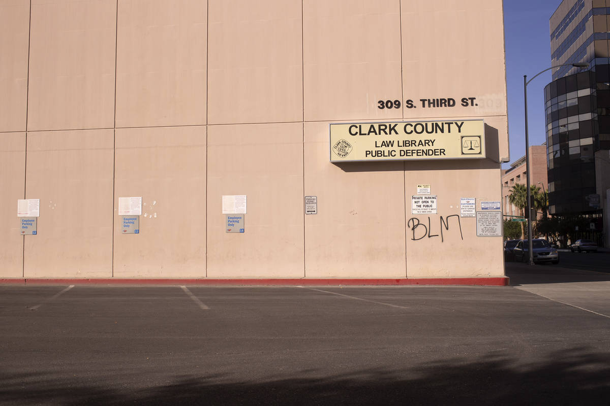 Black Lives Matter graffiti is spray painted on the Clark County Law Library following a night ...