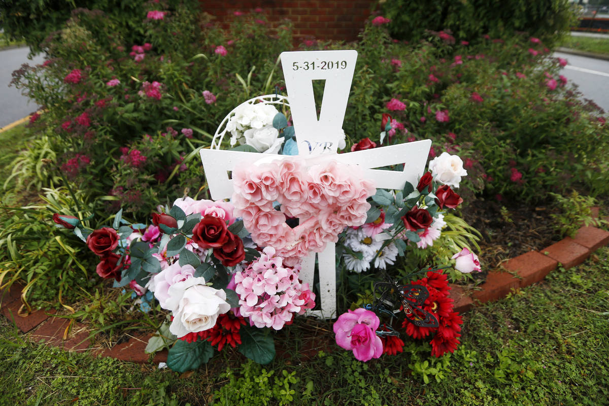 In this May 22, 2020, photo, a group of flowers and a cross mark the entrance to Jason Nixon's ...