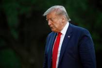 President Donald Trump walks across the South Lawn of the White House in Washington, Saturday, ...