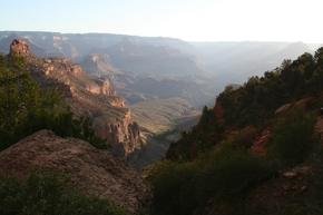 Early morning sunlight glows along the Bright Angel Trail at the South Rim of Grand Canyon Nati ...
