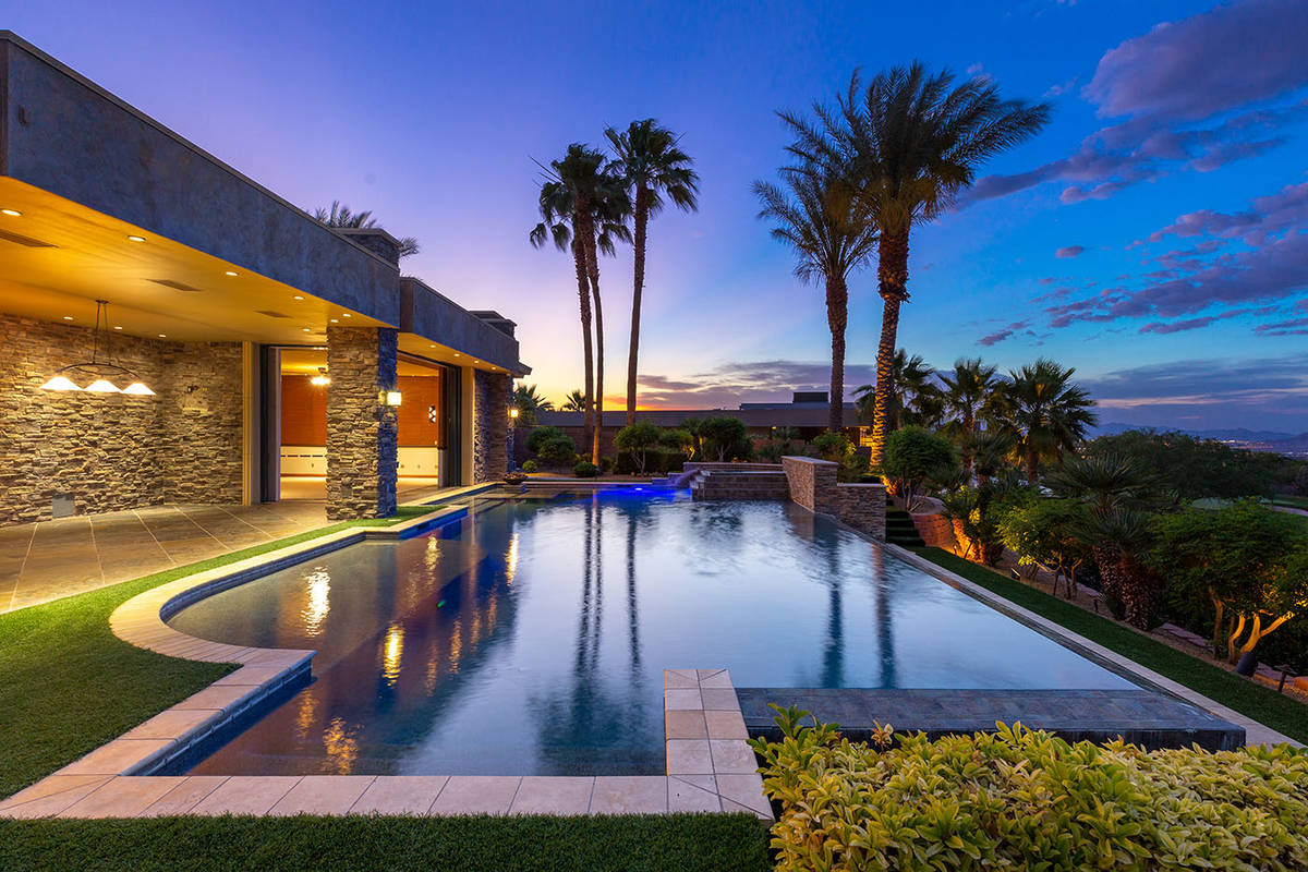 The home has cooled patio, outdoor kitchen and heated pool with a swim-up bar. (Ivan Sher Group)