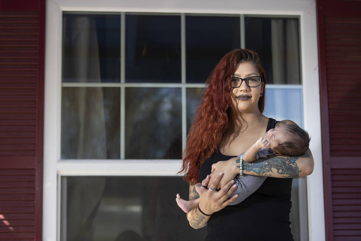 Former Nacho Daddy employee Ariel Gilstrap poses for a portrait with her newborn son, Kane Gils ...