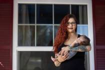 Former Nacho Daddy employee Ariel Gilstrap poses for a portrait with her newborn son, Kane Gils ...