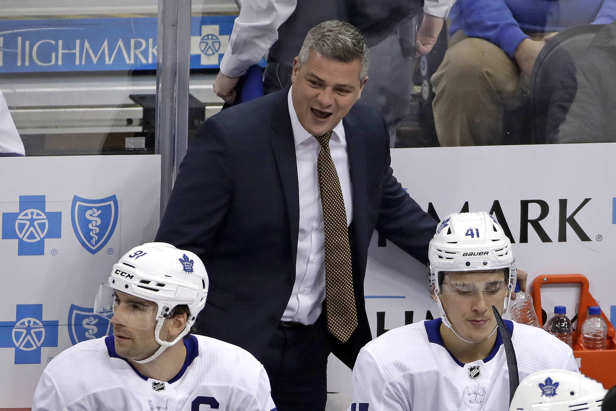Toronto Maple Leafs coach Sheldon Keefe walks behind his bench during the first period of the t ...