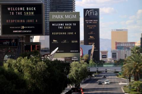 Marquees for MGM Resorts International properties on the Strip in Las Vegas, including from lef ...