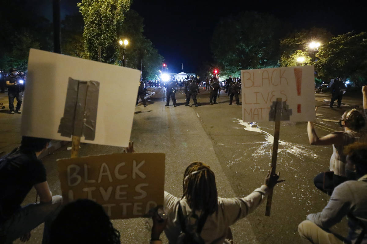 Demonstrators pprotest the death of George Floyd, Sunday, May 31, 2020, near the White House in ...