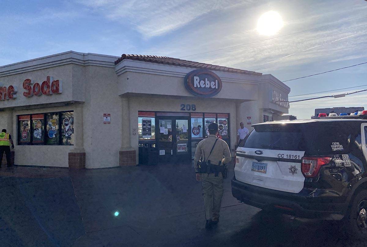A Las Vegas police officer heads toward a Rebel gas station on Monday, June 1, 2020, at East Tr ...