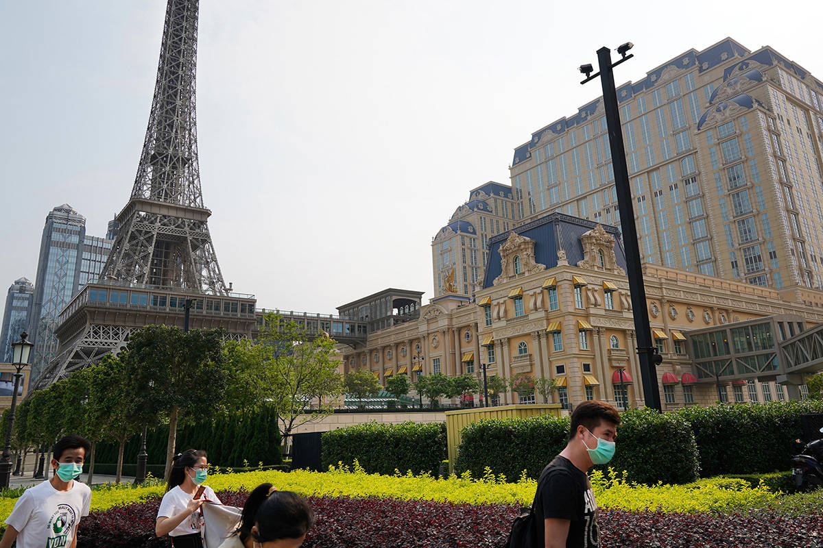 People walk along the sidewalk near the Parisian Macao on April 10, 2020. (Inside Asian Gaming)