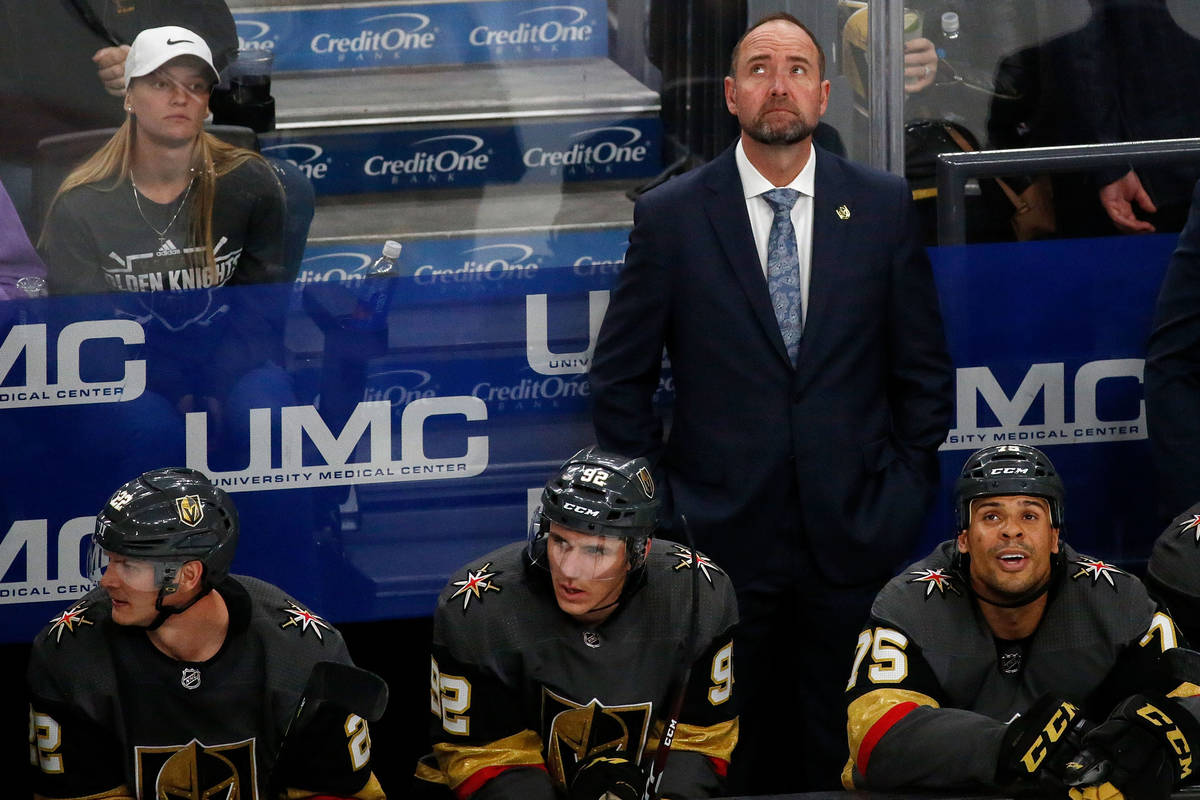 Vegas Golden Knights head coach Pete DeBoer looks up at the display board in the second period ...