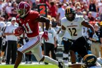In this Sept. 21, 2019, file photo, Alabama wide receiver Henry Ruggs (11) runs in for a touchd ...