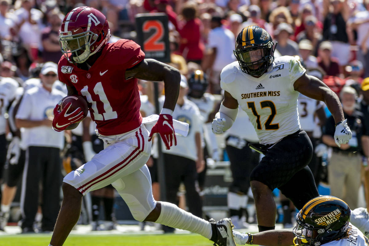 In this Sept. 21, 2019, file photo, Alabama wide receiver Henry Ruggs (11) runs in for a touchd ...