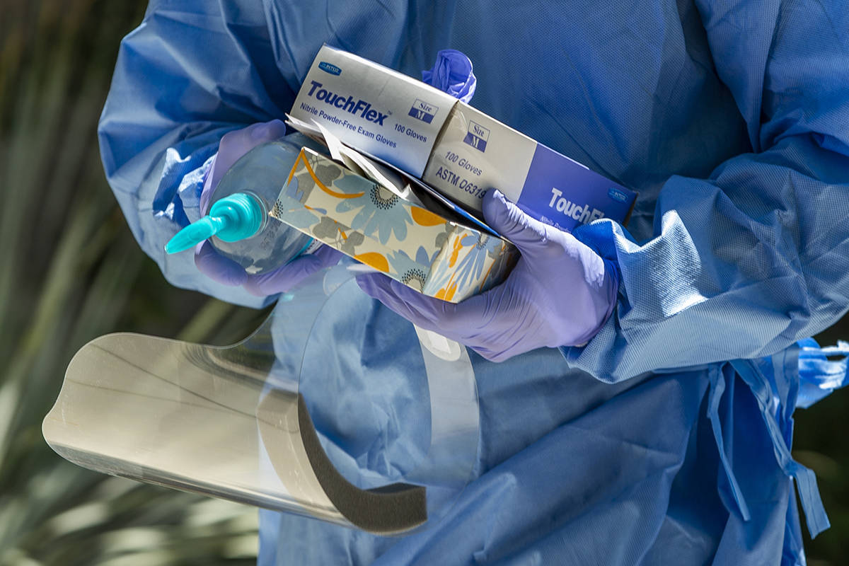 Nevada National Guard soldier PFC Nikolas Herrera carries tests and supplies during a walk-thru ...