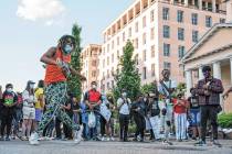 A group of dancers perform during a protest over the death of George Floyd, Sunday, May 31, 202 ...