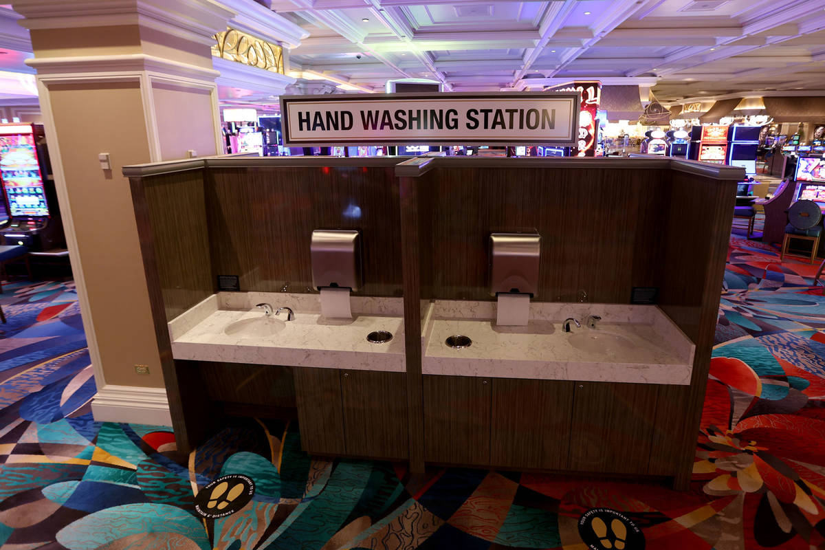 New hand washing stations on the casino floor during a Bellagio media a tour showing "heal ...