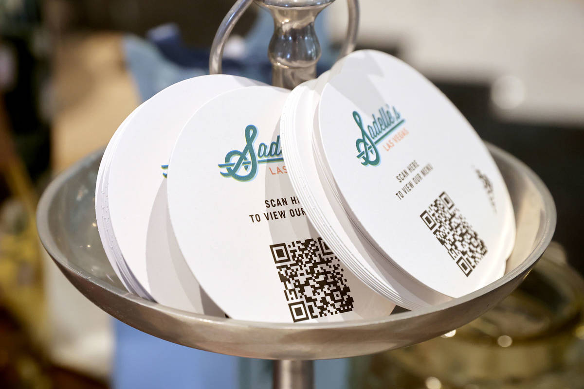 Coasters with QR code for the menu at SadelleÕs at Bellagio during a media a tour showing ...