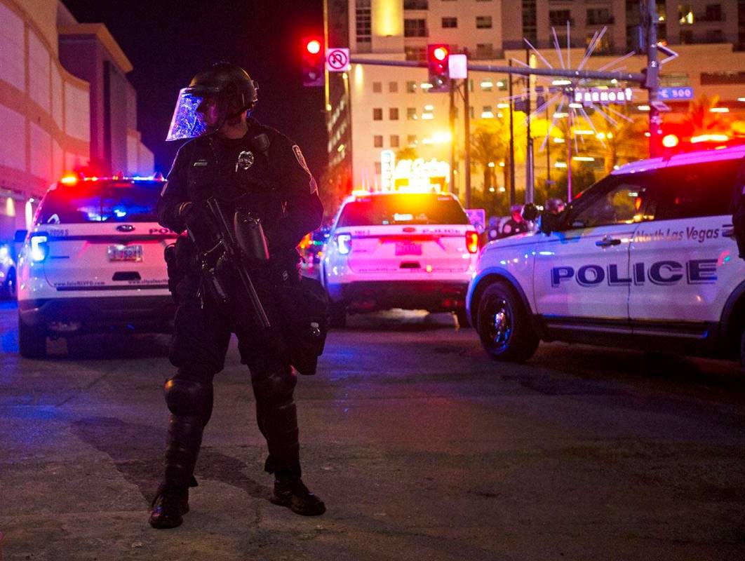 Police patrol Fremont Street during a protest organized by Black Lives Matter in downtown Las V ...