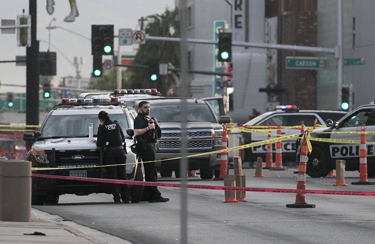 Las Vegas police investigate after a man was fatally shot outside the Lloyd George U.S. Courtho ...