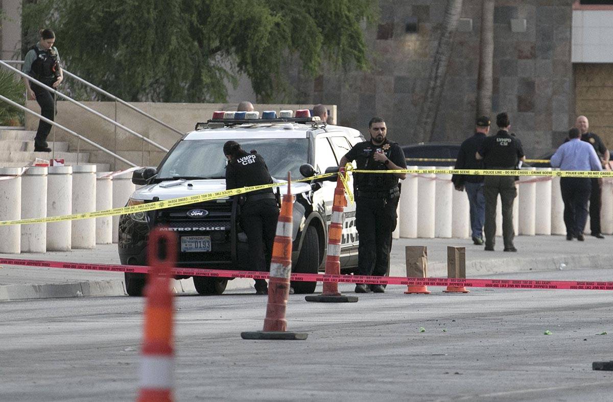 Las Vegas police investigate after a man was fatally shot outside the Lloyd George U.S. Courtho ...