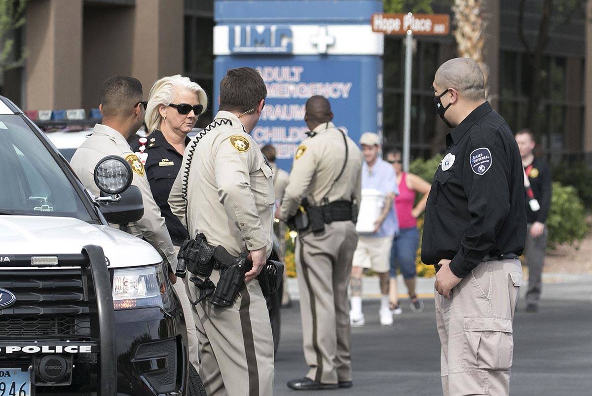 Las Vegas police officers gather outside University Medical Center on Tuesday, June 2, 2020. A ...