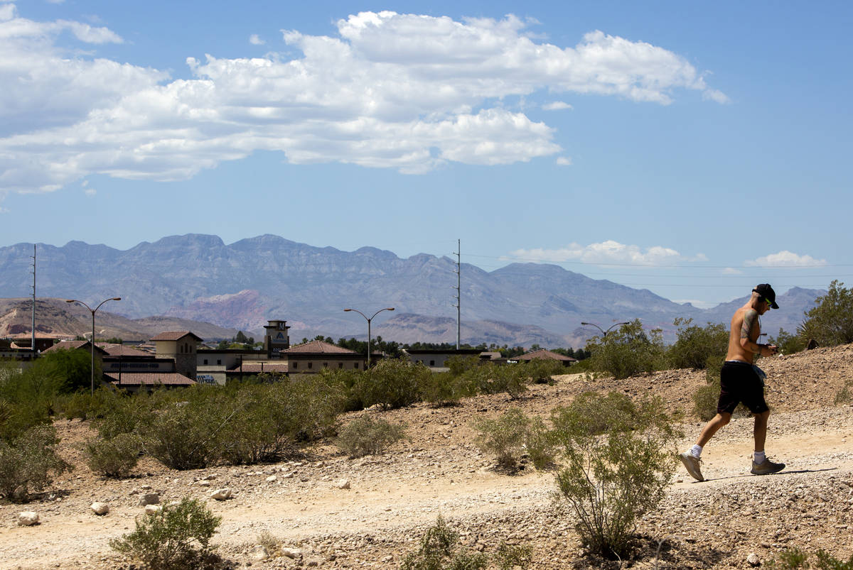 A man runs up the hill at Exploration Peak Park on Wednesday, May 27, 2020, in Las Vegas. The N ...