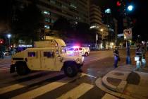 A military Humvee blocks an intersection along K Street in downtown Washington as demonstrators ...