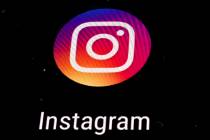 FILE - In this Nov. 29, 2018 file photo, the Instagram app logo is displayed on a mobile screen ...